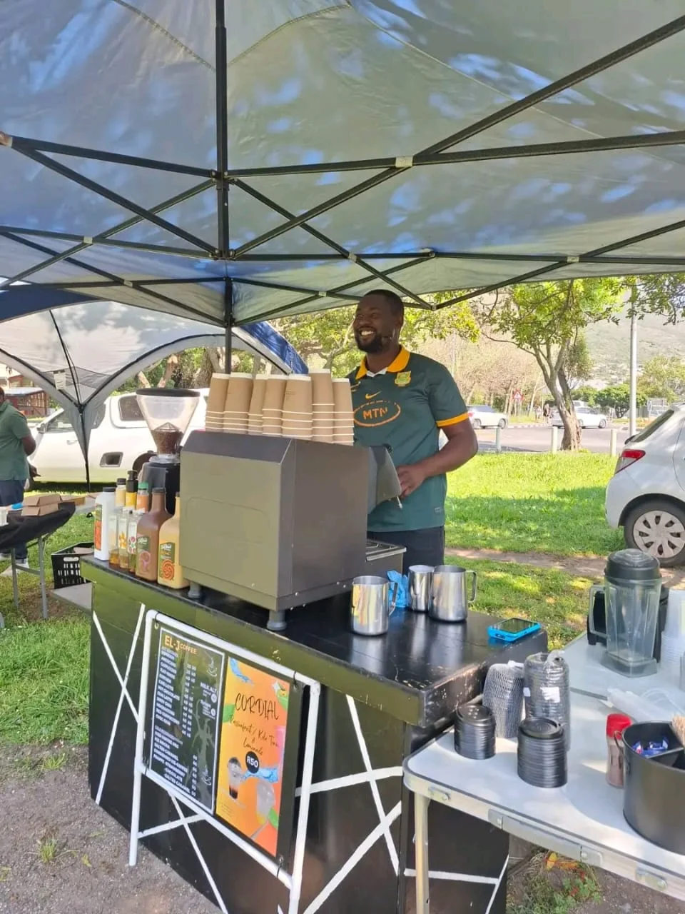 Mobile coffee cart setup at an outdoor market location